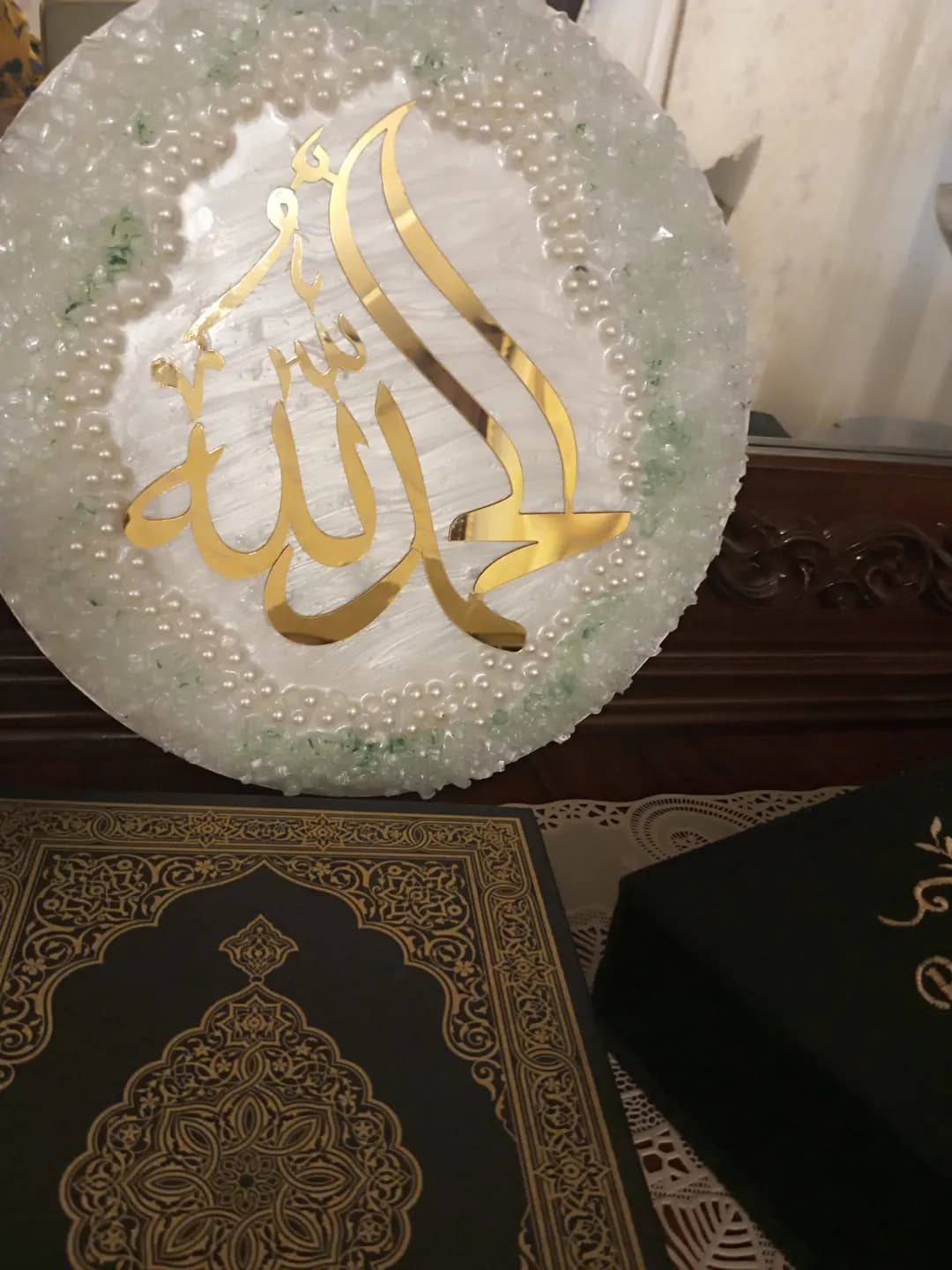 Islamic cardboard is made on a round tablet made of small stones with the inscription Allah