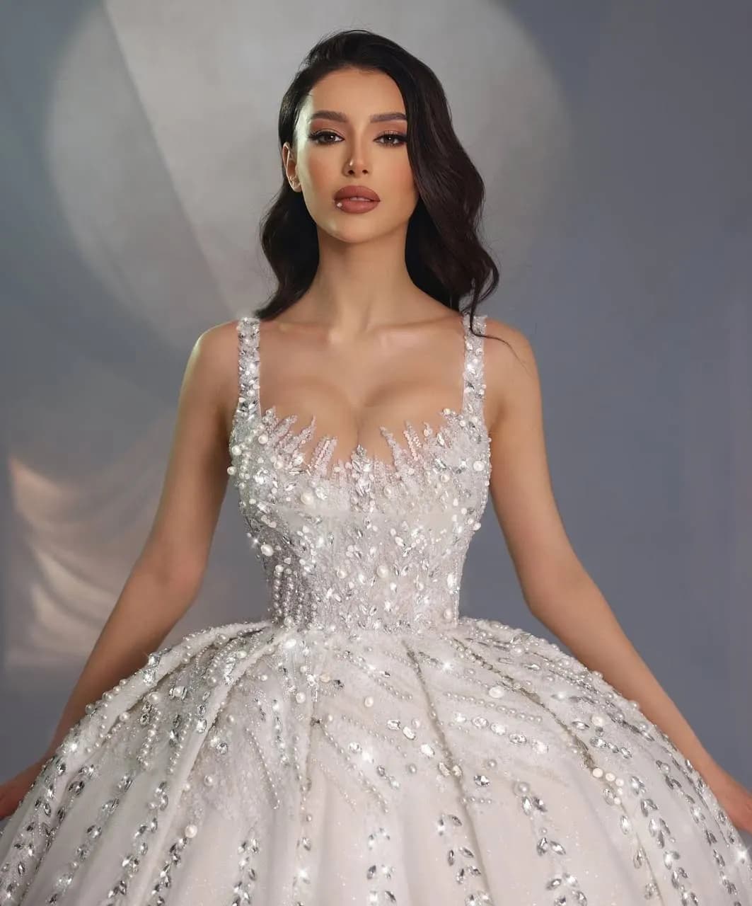 We need girls and women to attach stones to the bride's dress.