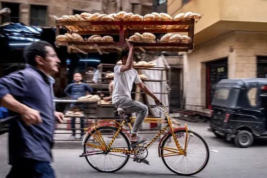 A worker is needed to distribute bread